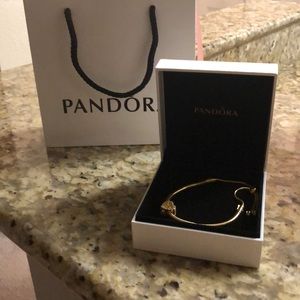 Gold pandora slide bracelet with heart charm